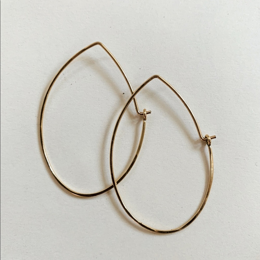 Delicate gold oval hoop earrings
